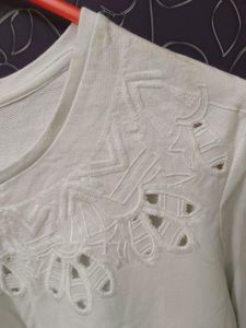 White sweater top with beautiful cut work....store