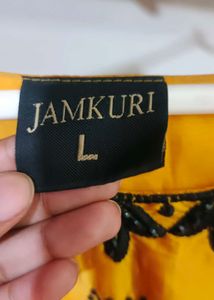 long yellow satin gown with black embroidery