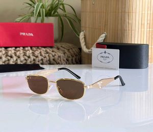 Prada Sunglasses - Gold Frame