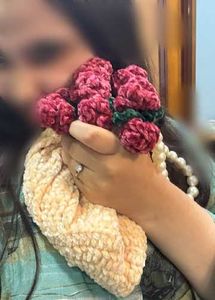 Unique Beaded Handle Clutch with Floral Accent