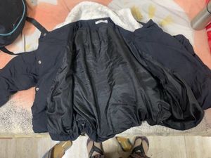 Black Puffer Jacket Had Adjustable Knot At The