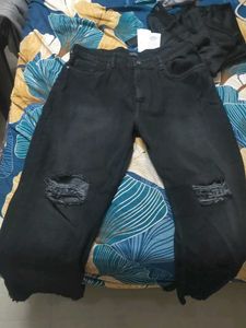 Black Distressed bootcut Jeans with hem