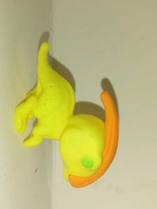 Yellow Toy Figure with Orange Hair