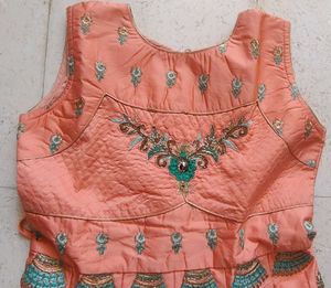 Ethnic peach gown with rich embroidery