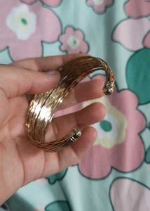 Elegant Gold Tone Twisted Bangle