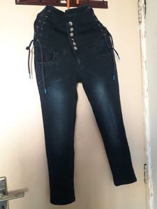 Stylish High-Waisted Jeans with Unique Details