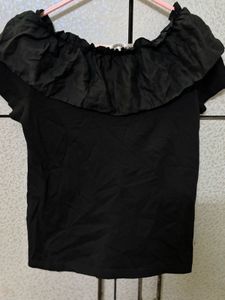 Chic Black Ruffled Top with Pearl Detail
