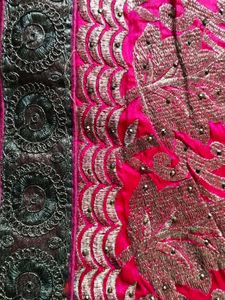 Elegant Pink Saree with Intricate Detailing