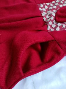 Free Delivery red dress with lace and bow detail.