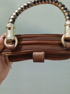 Stylish Brown Clutch with Unique Handle