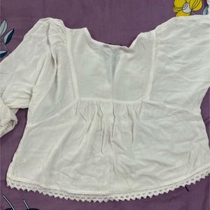 Embroidered White Peplum Top