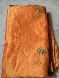 Elegant Orange Saree with Floral Print