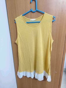 Yellow Sleeveless Top with Ruffle Hem