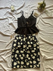 Chic Black Peplum Top &amp; Printed Skirt Set