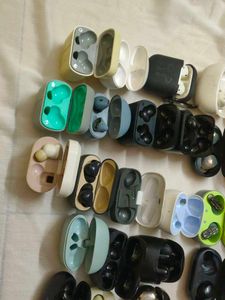 Assorted Earbud Cases and Earbuds