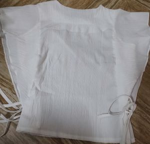 White Top With Shoulder Frill And Knot Style.
