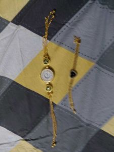 Elegant Gold Chain Watch with Charm Bracelet