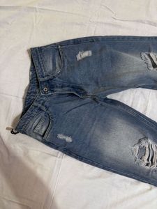 Distressed Blue Denim Jeans