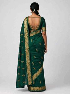 Elegant Emerald Green Saree with Gold Embellishmen