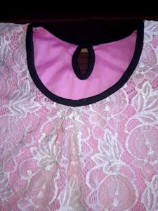 Pink Lace Topwith Magenta bottom wear.