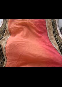 Exquisite Peach and Gold Net Saree