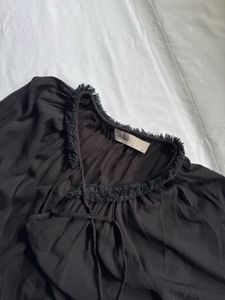 Oversized black tie front blouse