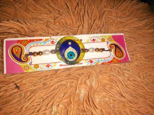 Resin Rakhi with Pearl Beads