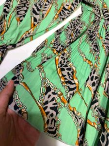 Green Cheetah Print peplum top fits S-M