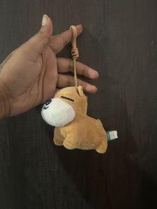 brown plush dog bag charm/keyring with a sleeping