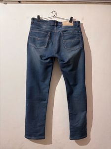 Distressed Blue Denim Jeans