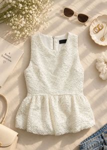 The ivory peplum top