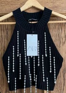 Chic Black Ribbed Top with Pearl Embellishments