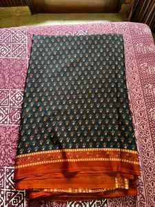 Elegant Black Saree with Orange Border