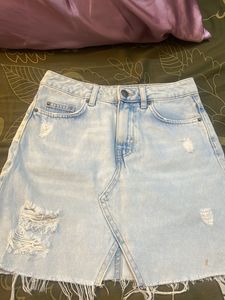Light Wash Distressed Denim Skirt