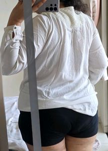 Elegant White Top with Textured Yoke