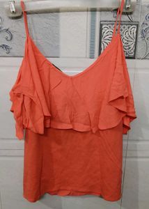 Coral coloured chic and elegant top