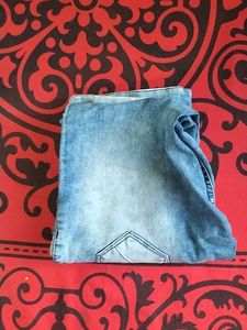39.Distressed High-Waisted Blue Jeans