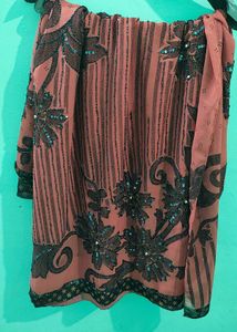 Elegant Coral Saree with Black Floral Print
