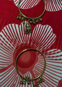 Set of 4 Gold Tone Bangles with Charms