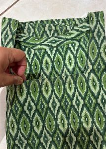 Stylish printed short kurti with square neck.
