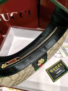 GUCCI* *GG MARMONT HALF-MOON-SHAPED MINI BAG*