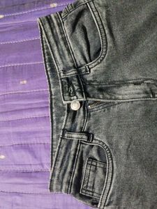 A charcol colour jeans with comfortable material.