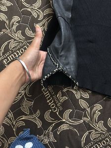 Chic Black Top with Faux Leather Sleeves