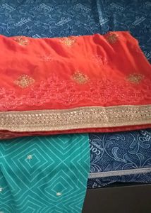 Orange Embroidered Saree with Gold Border
