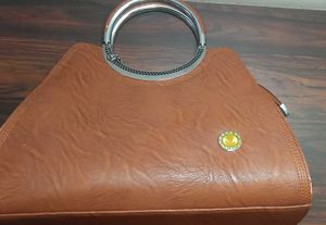 Chic Brown Handbag with Ring Handle