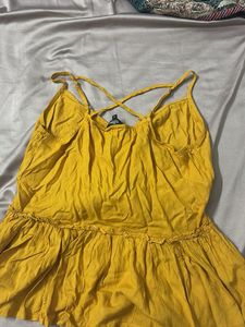 cute mustard sleeveless peplum top