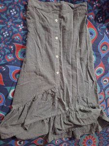Black and white checked skirt.