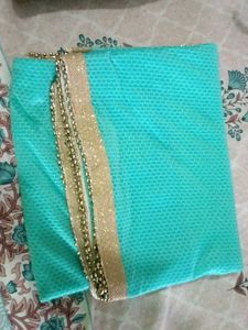 Beautiful Turquoise Saree with Gold Border