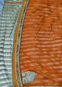 Elegant Orange Saree with Embellished Border