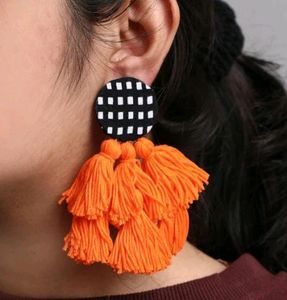 Orange tassel earrings